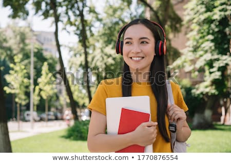 [[stock_photo]]: Young Woman With Earphones