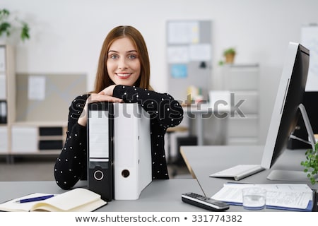 Foto stock: Smiling Secretary Or Personal Assistant