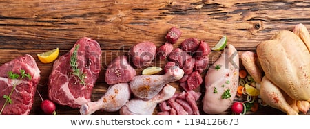 Foto stock: Meat Fillet On A Table With Spices And Vegetables