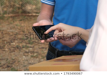 Stock photo: Adult Business Man Phoning In A Carton Box