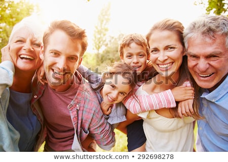 Foto stock: Young Man And Woman Embrace And Having Fun Outdoors