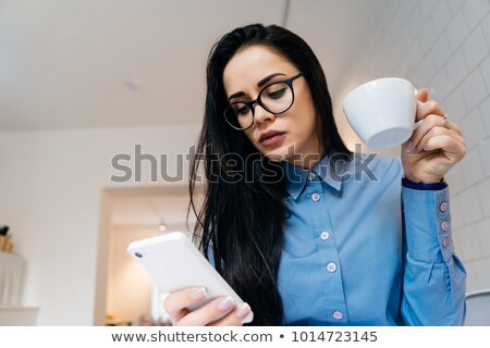 [[stock_photo]]: Happy Young Caucasian Lady Talking By Phone Drinking Coffee