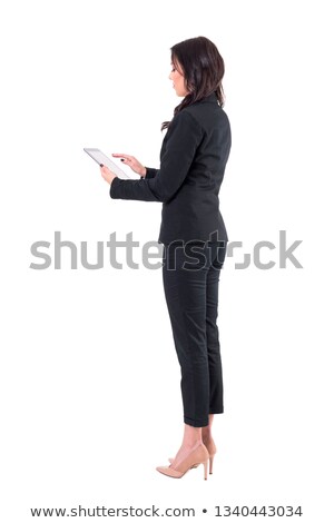 [[stock_photo]]: Beautiful Business Woman Standing With Tablet On White Background