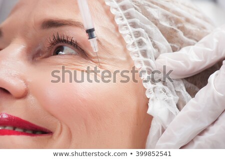 Stockfoto: Woman Gets Rid Of Wrinkles