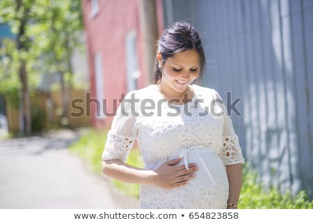 [[stock_photo]]: Pregnant Woman Posing In The Neighborhood