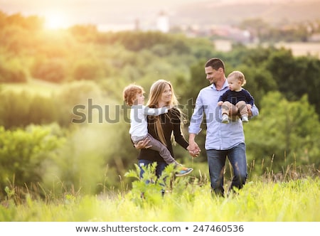 ストックフォト: Happy Family Walking In Summer Park