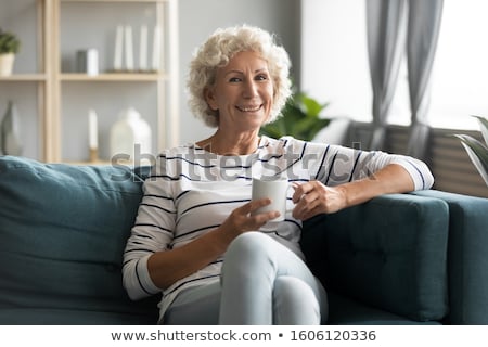 Foto stock: Concept Of Drinks And Lifestyle Carefree Satisfied European Man With Bristle Enjoys Sunny Day And H
