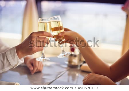 Foto d'archivio: Man Sitting Holding Champagne Glass