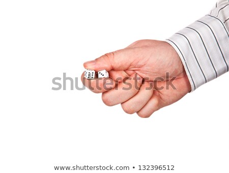 [[stock_photo]]: Mans Hand Holding White Casino Dice