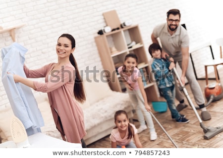 Stock photo: Girl Engaged In Home Cleaning