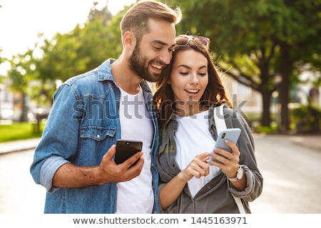 Stock fotó: Guy And Girl On A City Street