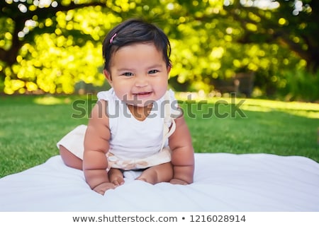 [[stock_photo]]: Girl Sitting With Her Friends In The Garden