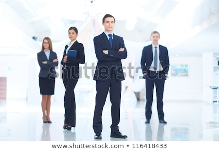 Сток-фото: Portrait Of Confident Handsome Elegant Responsible Businessman With Hands In Pockets On Black Backgr
