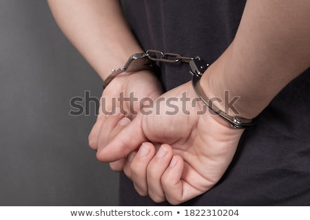 Stock fotó: Dark Backgrounded Close Handcuffed Man