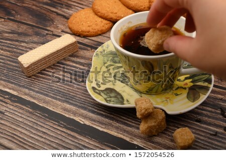 Stock foto: Brown Cane Sugar In Two Wooden Spoons On Black Background
