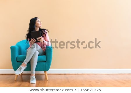 Stock fotó: Beautiful Woman With Tablet Computer On Chair