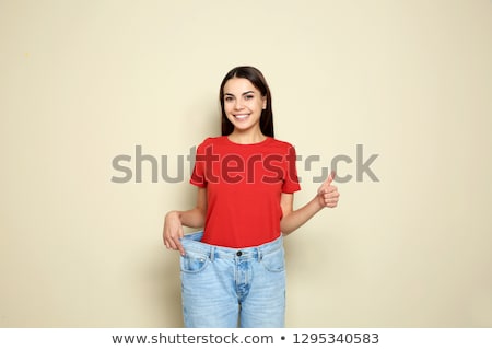 ストックフォト: Happy Girl In Jeans After Losing Weight