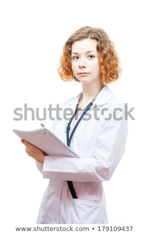 Foto stock: Cute Redhead Doctor In Lab Coat With Notebook