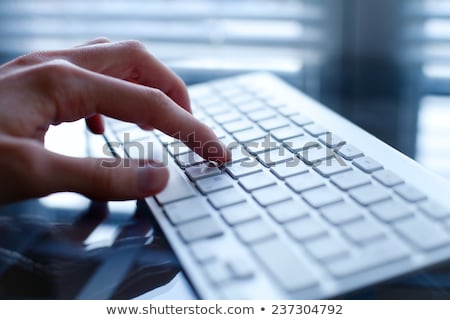 Stockfoto: Finger Presses Blue Keyboard Button Book Online