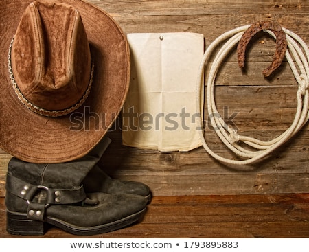 Foto stock: Old Horseshoe And A Sheet Of Paper