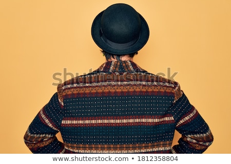 Stok fotoğraf: Portrait Of A Young Man Wearing A Hat