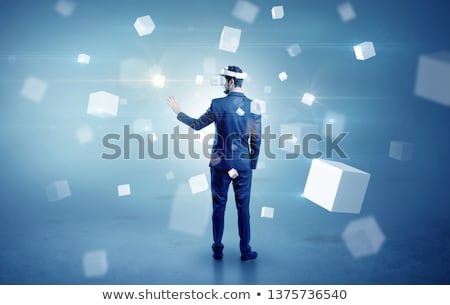 Stock photo: Businessman With Vr Goggle And Falling Cubes