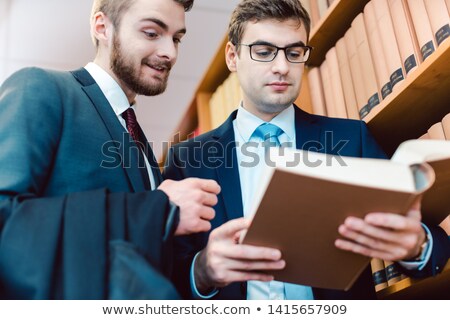 Stockfoto: Two Lawyers In The Law Firm Discussing Cases And Precedents