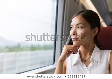 Asian Woman Traveler Contemplating Outdoor View From Window Of Train Young Lady On Commute Travel T Stockfoto © Maridav