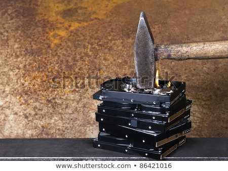 Foto stock: Hammer And Burning Hard Disks