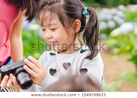 Stock foto: Mom And Daughter Practicing Shooting