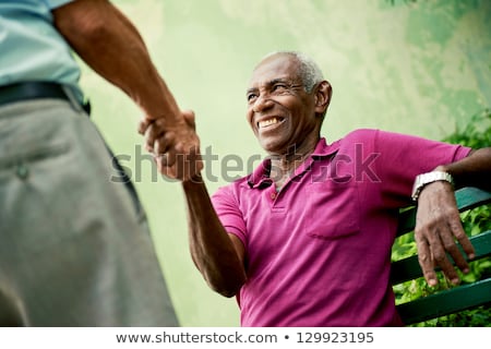 Foto stock: Green Black Handshake