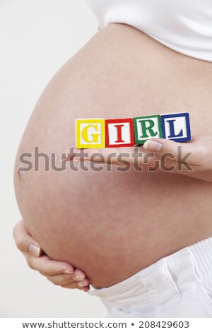 Stock foto: Close Up Of Pregnant Woman Holding Blocks Spelling Girl