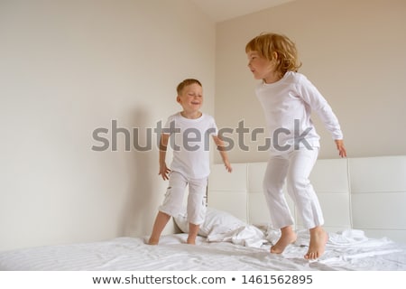 Stock photo: Little Girl In Nightwear On White