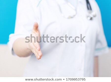 Female Doctor With Open Hand Ready For Handshake In Hospital [[stock_photo]] © gladcov