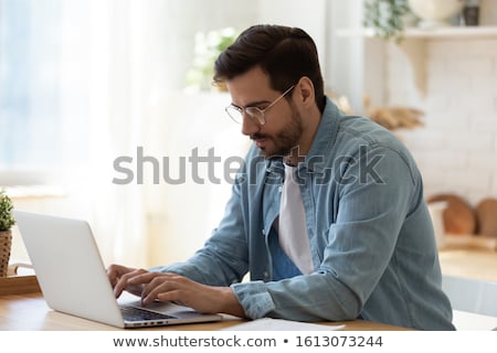 Foto stock: Man Sitting At The Table With Book In University