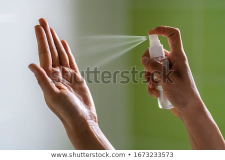 Foto stock: Female Hand With Bottle Of Fresh Water