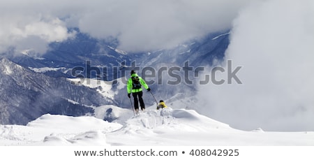 Freeriders On Off Piste Slope And Mountains In Mist Сток-фото © Lizard