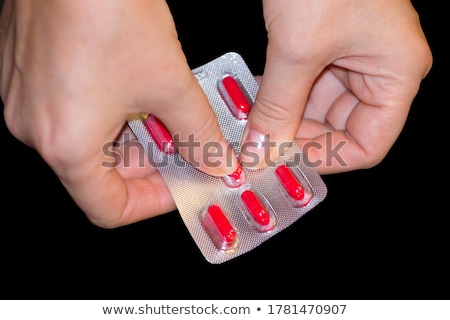 Stock fotó: Woman Hands Opening Pack Of Medicine Capsules