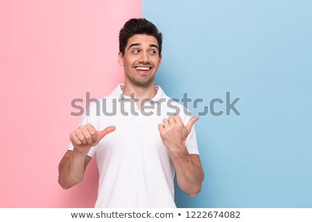 Zdjęcia stock: Image Of Handsome Man 30s Having Stubble Pointing Fingers Aside