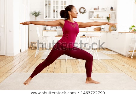 Stockfoto: Woman Doing Warrior Yoga Pose