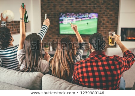 Zdjęcia stock: Friends With Beer And Popcorn Watching Tv At Home