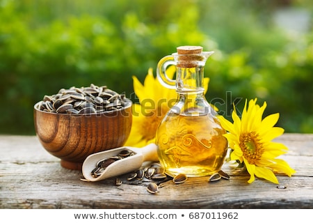 Stock fotó: Bottles Of Sunflower Oil With Flower