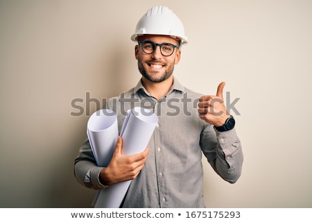 Foto stock: Architect Holding Plans And At Symbol