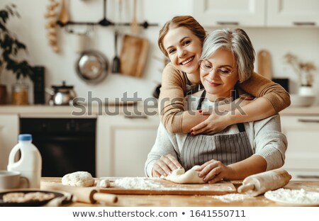 Stockfoto: Little Girl Cooking With Grandma
