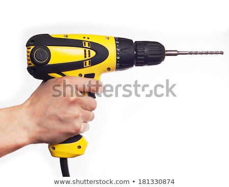 [[stock_photo]]: Hand Holding Drill At Wall