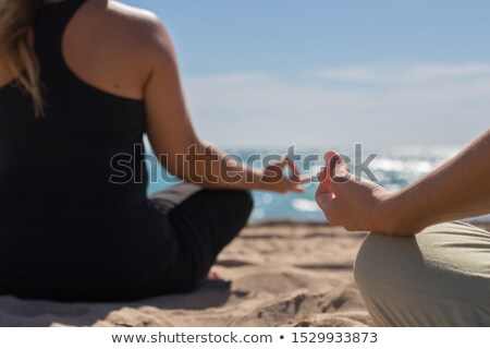 Stock photo: Young Man Practicing Warrior 2 Pose At Beach