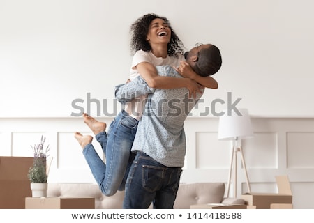 Stok fotoğraf: Young Wife Celebrating With Husband