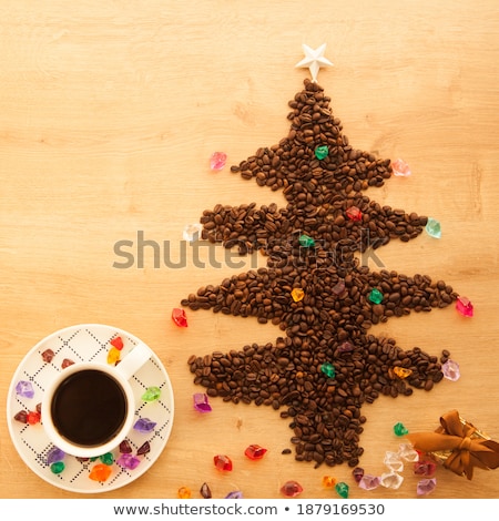 Foto stock: Beans In Shape Of Fir And Cup Of Coffee