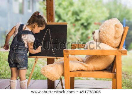 Stok fotoğraf: Back To School Lettering On Blackboard With Piece Of Chalk