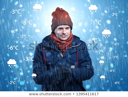 Foto d'archivio: Boy Freezing In Warm Clothing With Weather Condition Concept